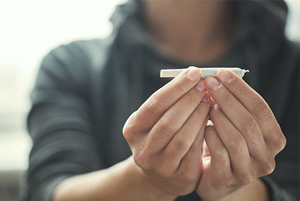 girl holding marijuana joint 2